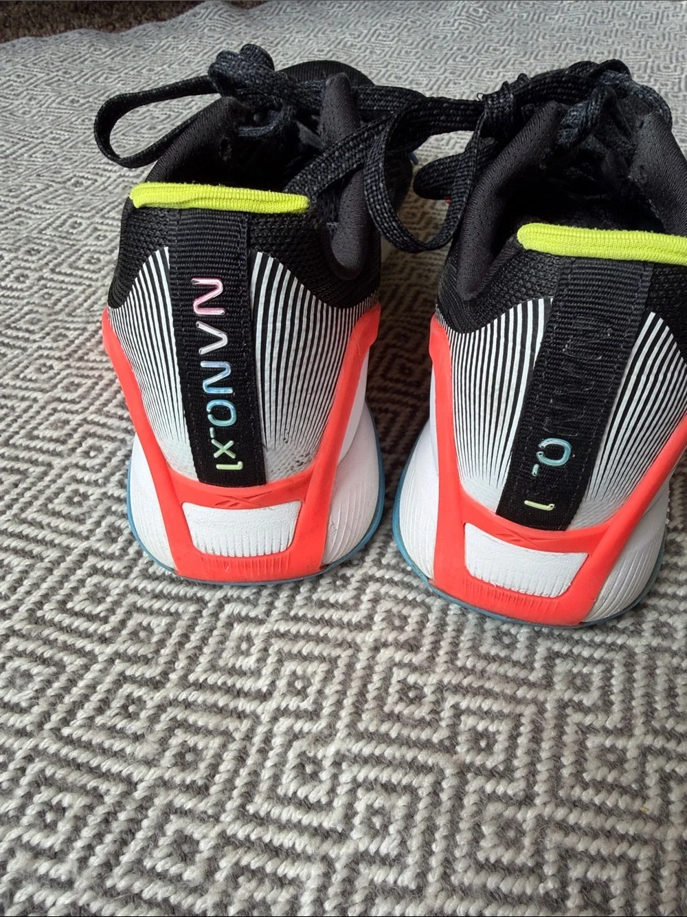 Reebok Nano X1 Black Running Shoes with Yellow, Red and Blue Accents